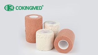 Bandage élastique adhésif en coton